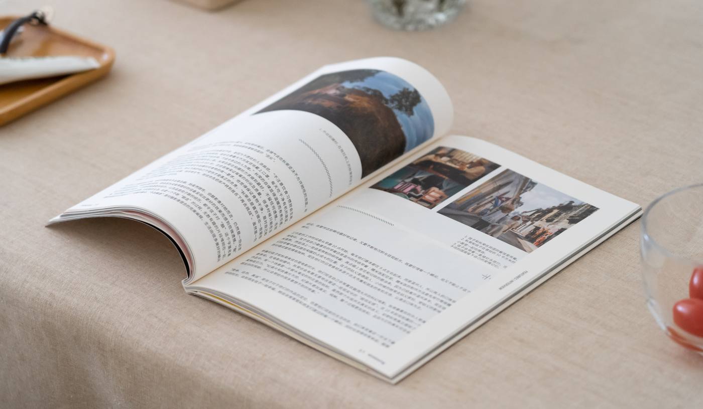 Open magazine with an editorial photo spread